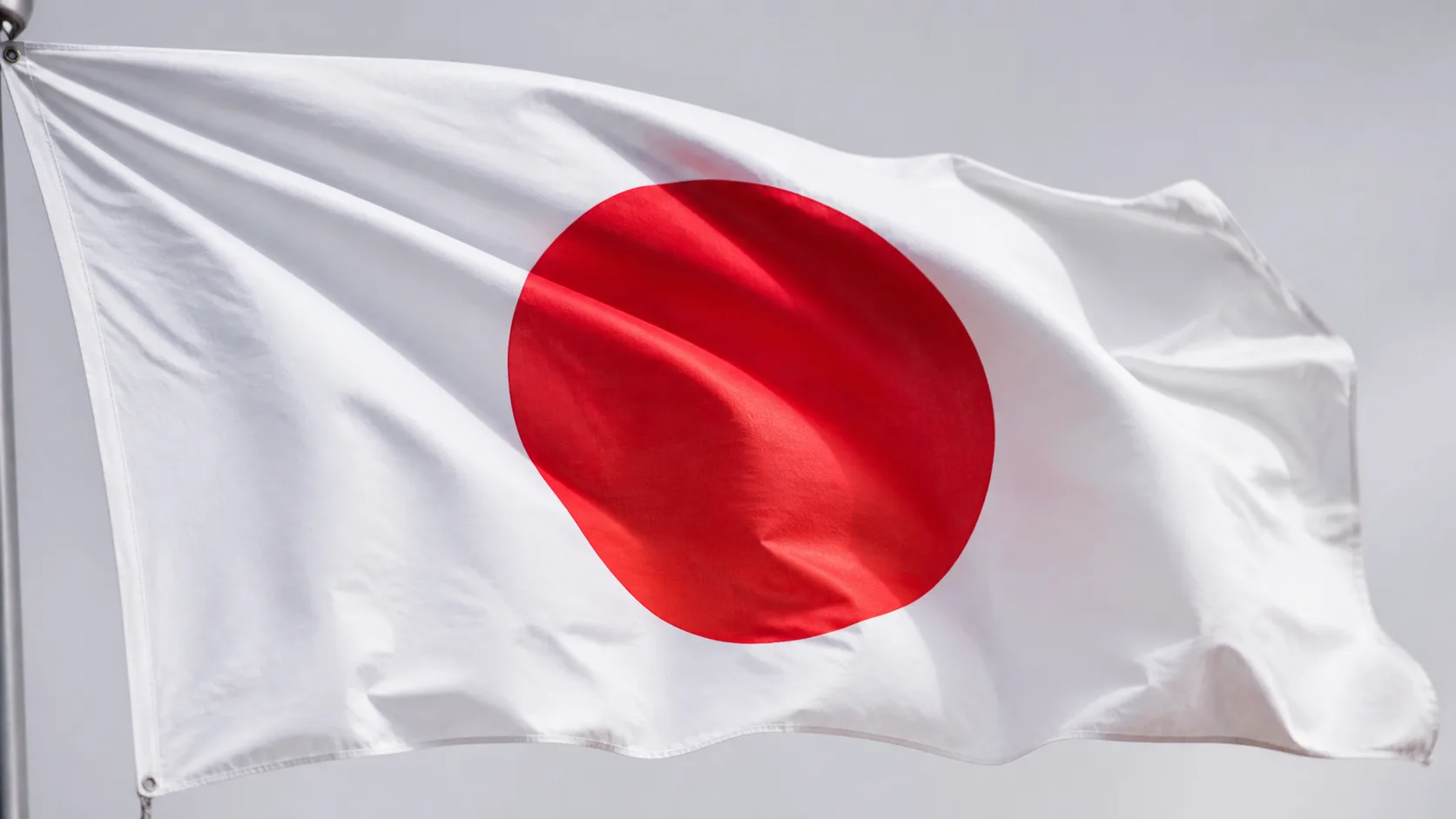 Editorial image of a Japanese flag made of fabric in soft light